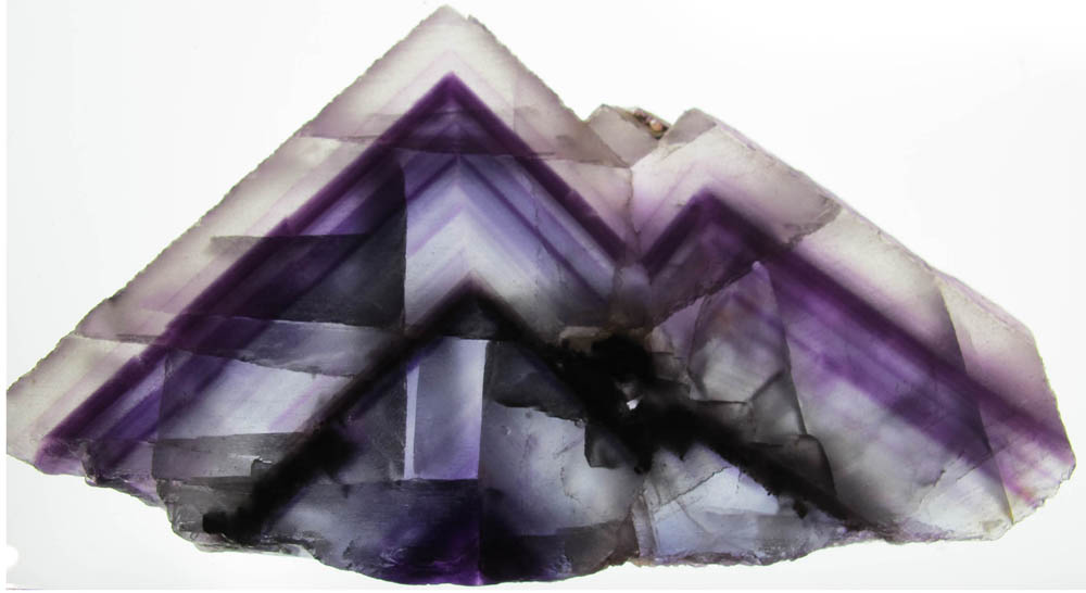 section of a fluorite crystal zoned in purple and clear
